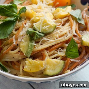 Overhead shot of Creamy Zucchini Spaghetti with Vegan Feta Sauce in a serving bowl.