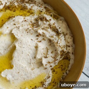 Vegan Whipped Feta in a bowl, garnished with herbs