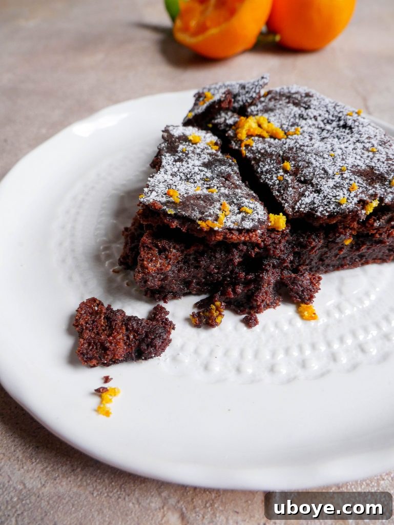 Serving suggestion for the chocolate fudge clementine cake with whipped cream