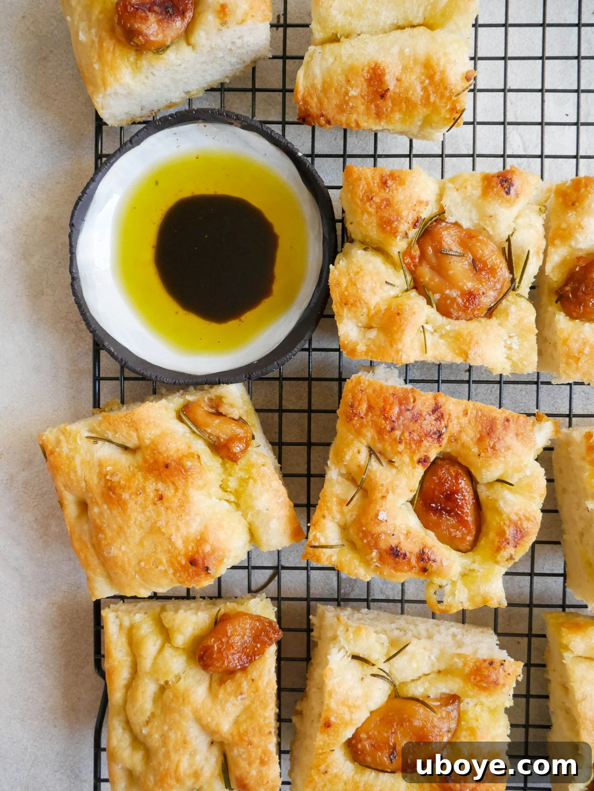 Easy No Knead Garlic and Rosemary Focaccia 8 Freshly baked focaccia cooling on a wire rack, ready to be stored or served