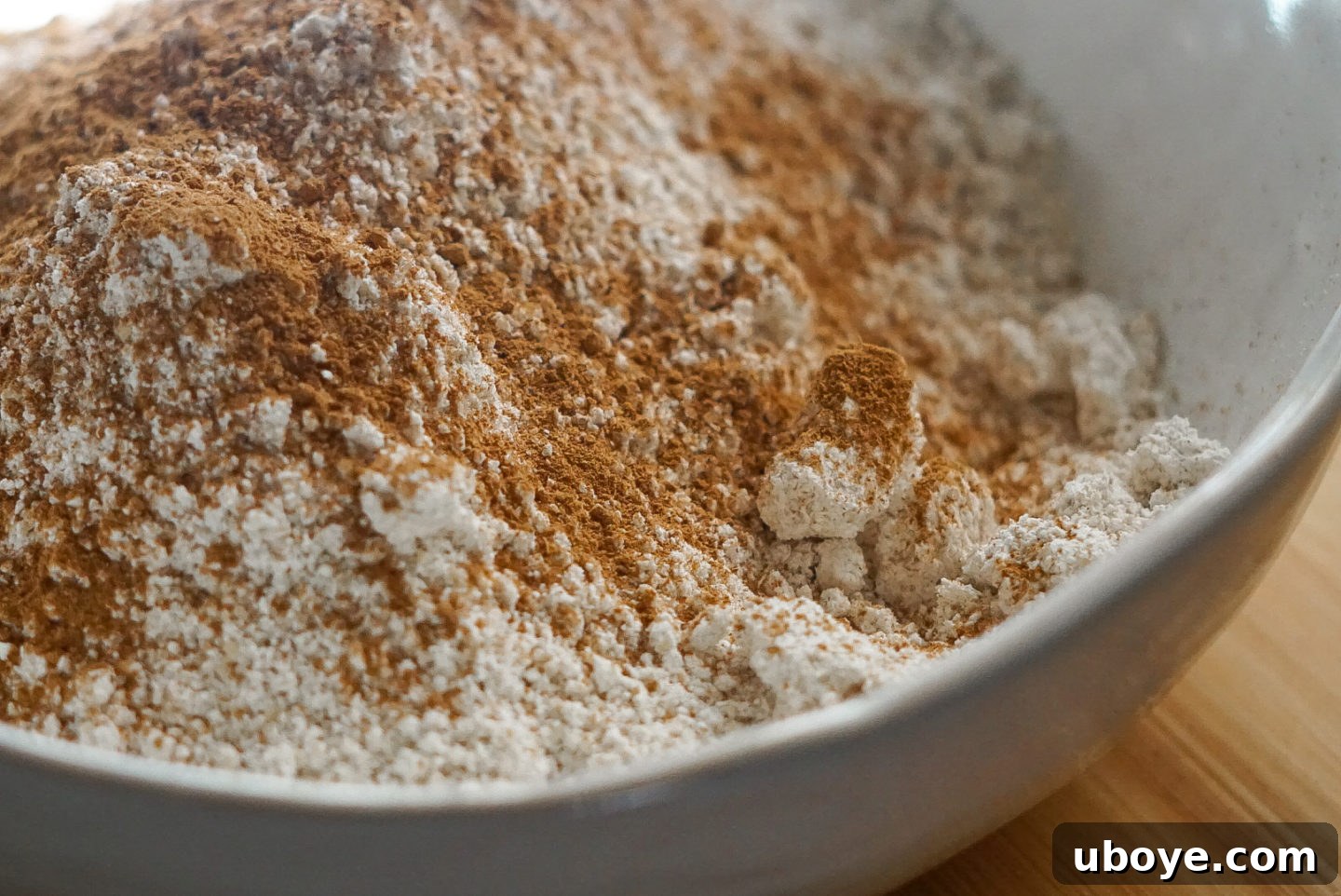 Close-up of fluffy vegan pumpkin pancakes, showing their airy texture and golden edges, ready for toppings.