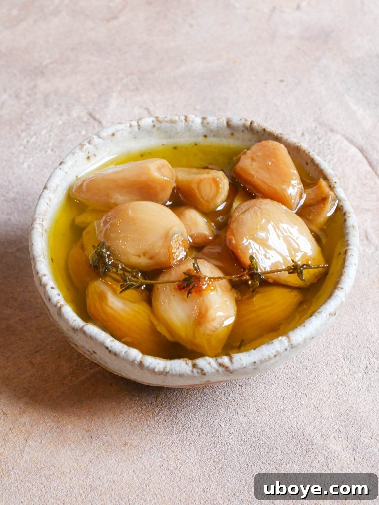 Individual cloves of garlic confit in olive oil
