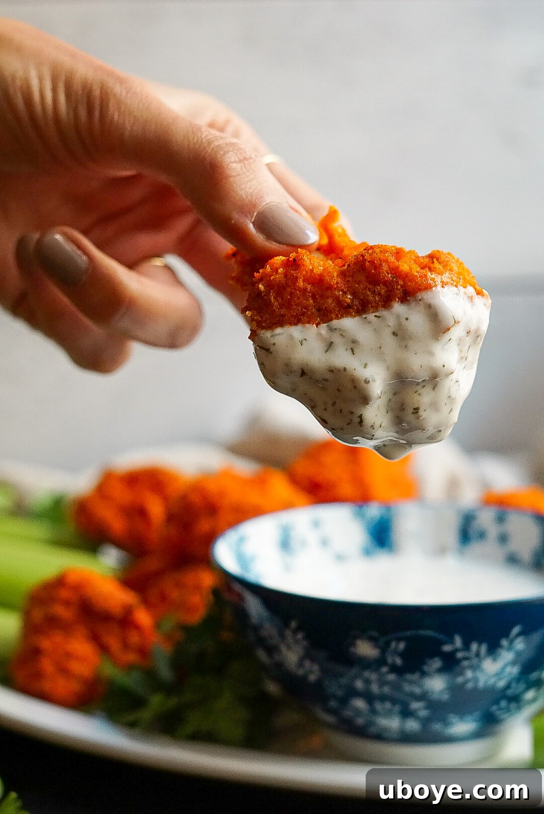 Platter of freshly baked vegan buffalo cauliflower wings