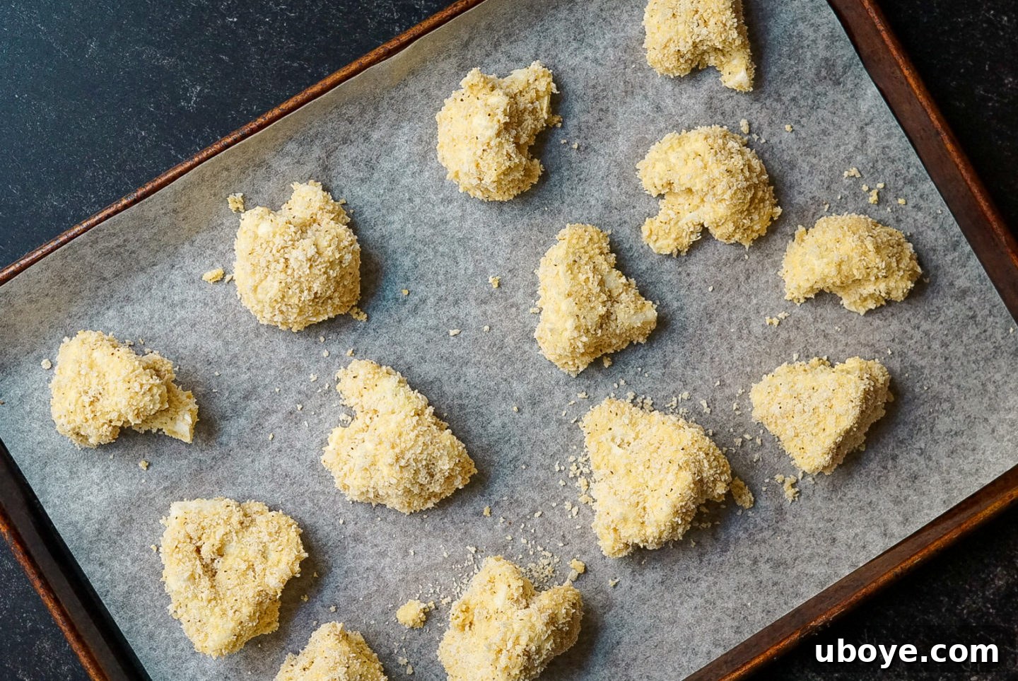 Cauliflower florets being coated in panko breading