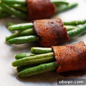 Close-up of a single vegan green bean and bacon bundle, perfectly baked and golden.