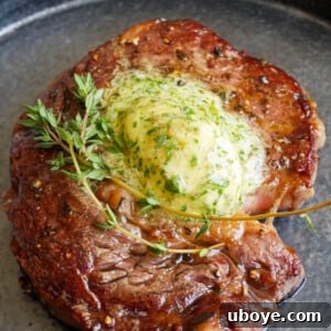 Thumbnail image of the Garlic Confit Butter Steak, a close-up showing the melted butter and herbs.