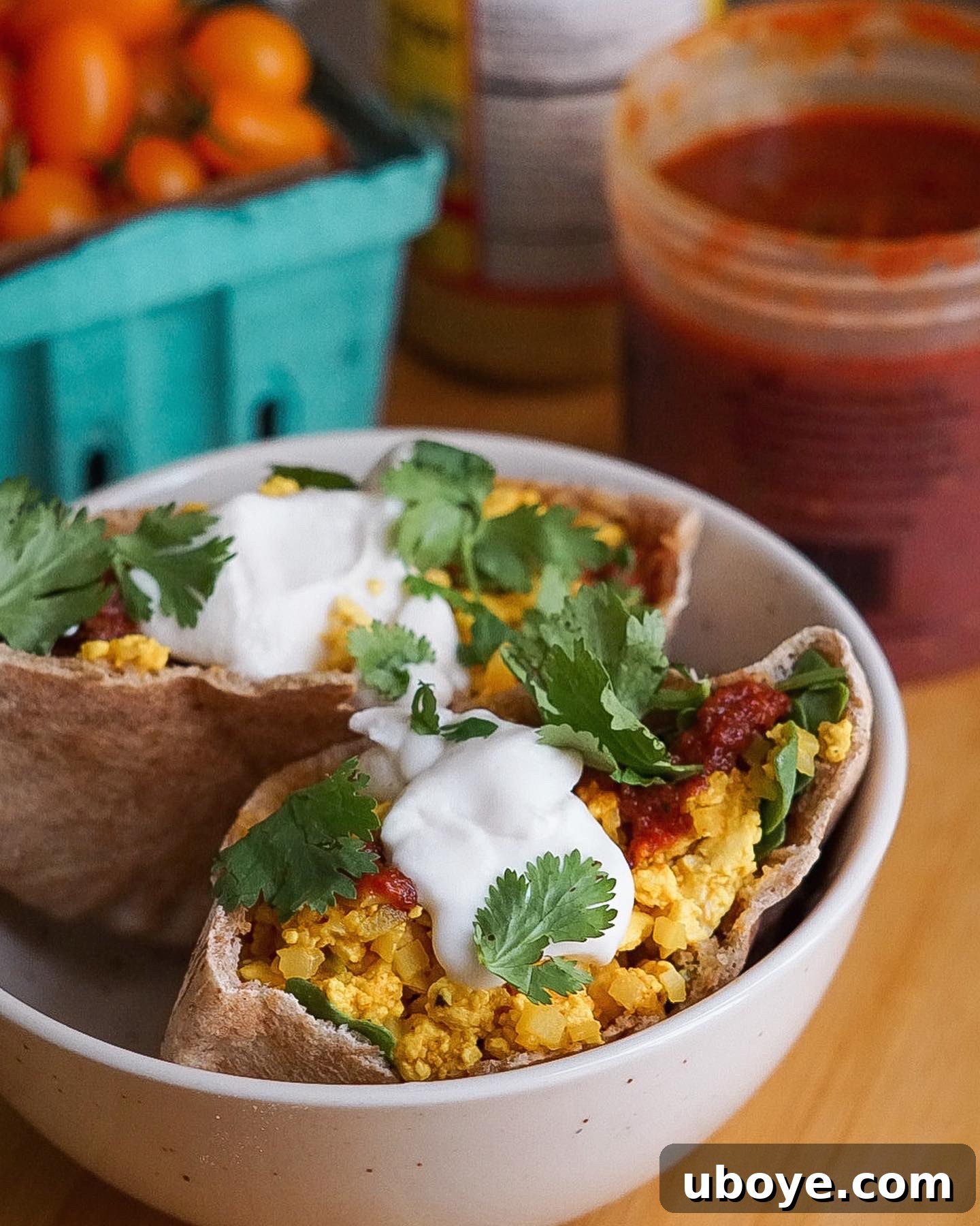 A beautifully plated tofu scramble dish, garnished with fresh herbs, showcasing a delicious vegan breakfast option.