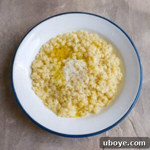 A bowl of easy pastina with parmesan and a drizzle of olive oil.
