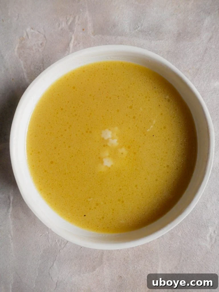 A cozy bowl of Pastina in Chicken Broth, garnished and ready to be enjoyed.