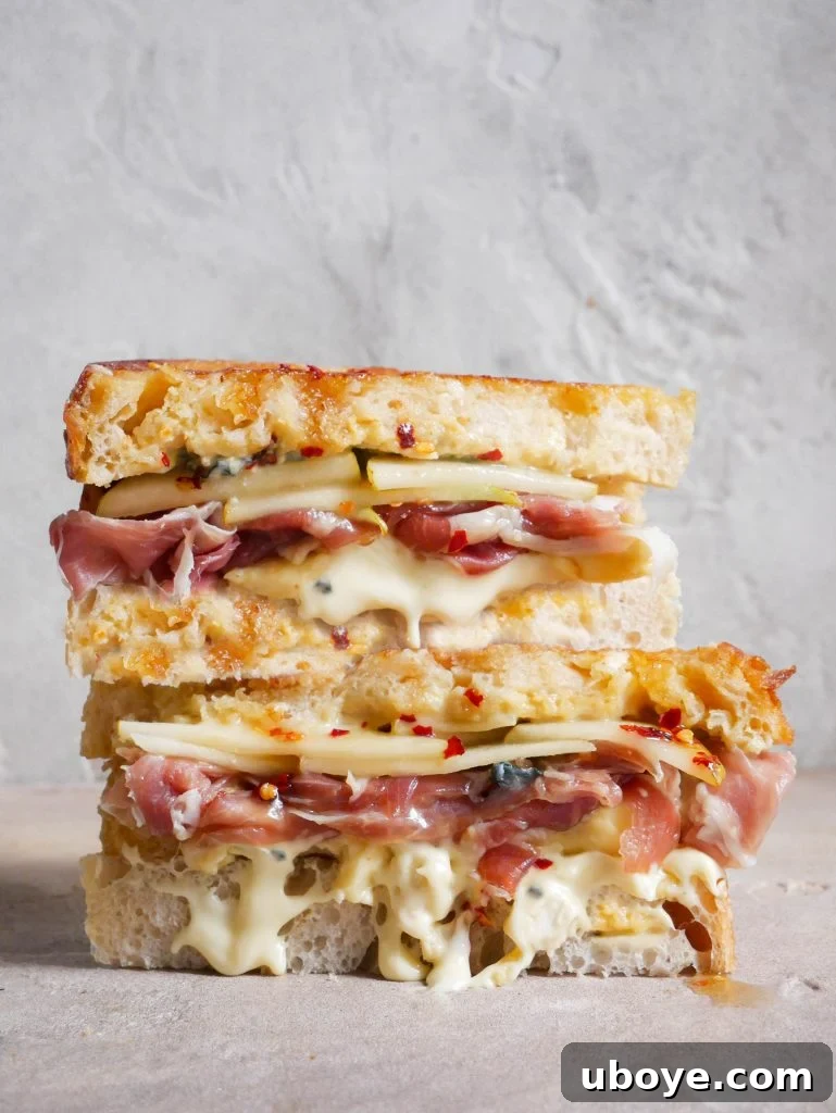 Decadent Triple Cream Brie & Hot Honey Toastie with pear and prosciutto filling