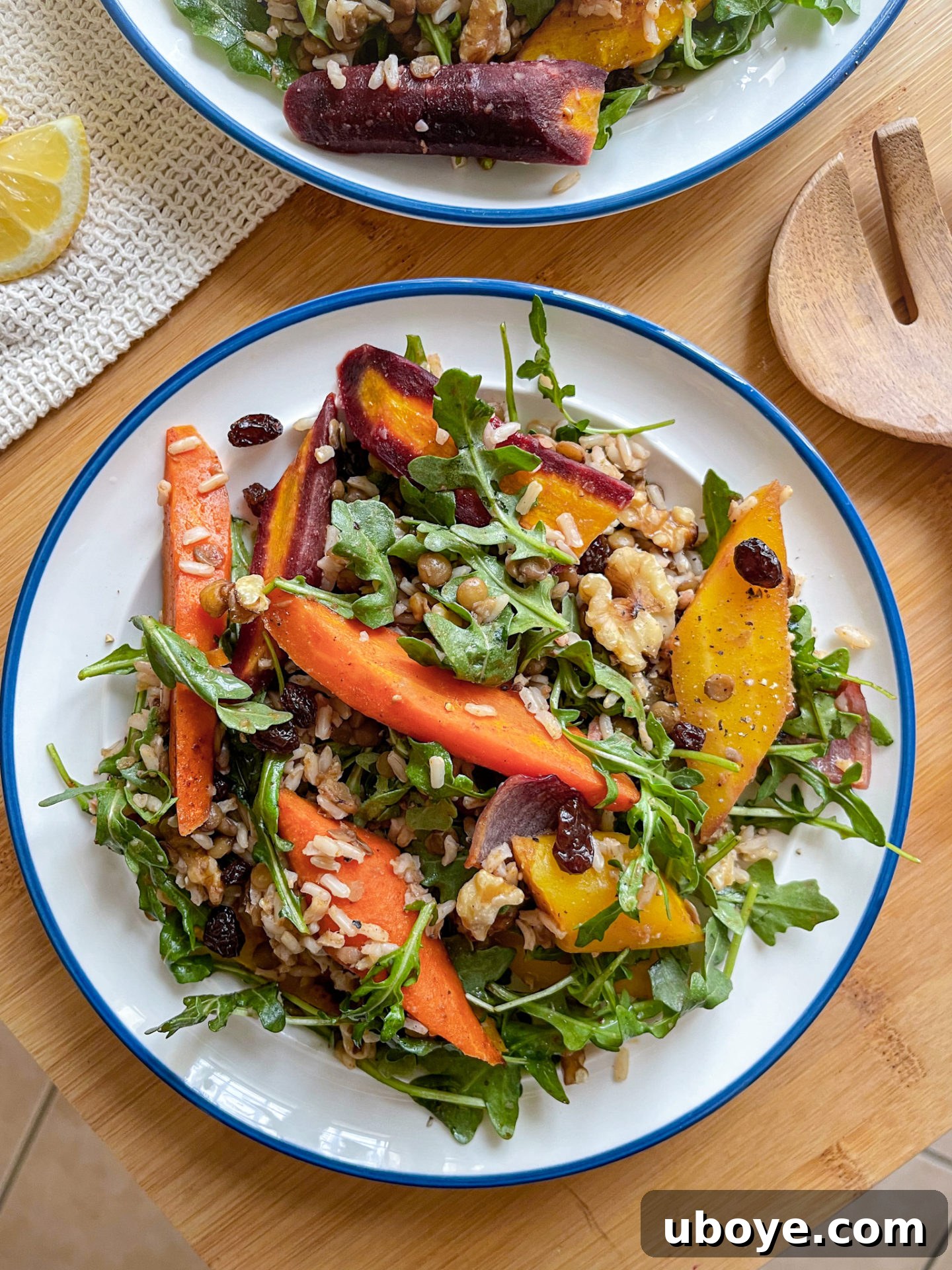 Vibrant Carrot, Lentil, and Arugula Salad with Miso Brown Rice, garnished with walnuts