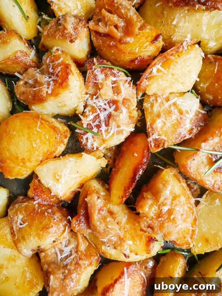 Garlic confit crispy roasted potatoes in a rustic pan, freshly cooked and garnished