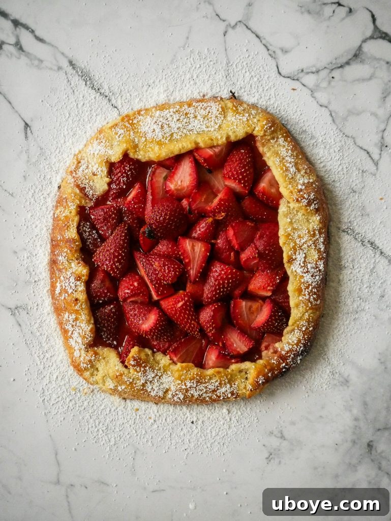 Strawberry galette with cream cheese puff pastry, golden brown and sliced