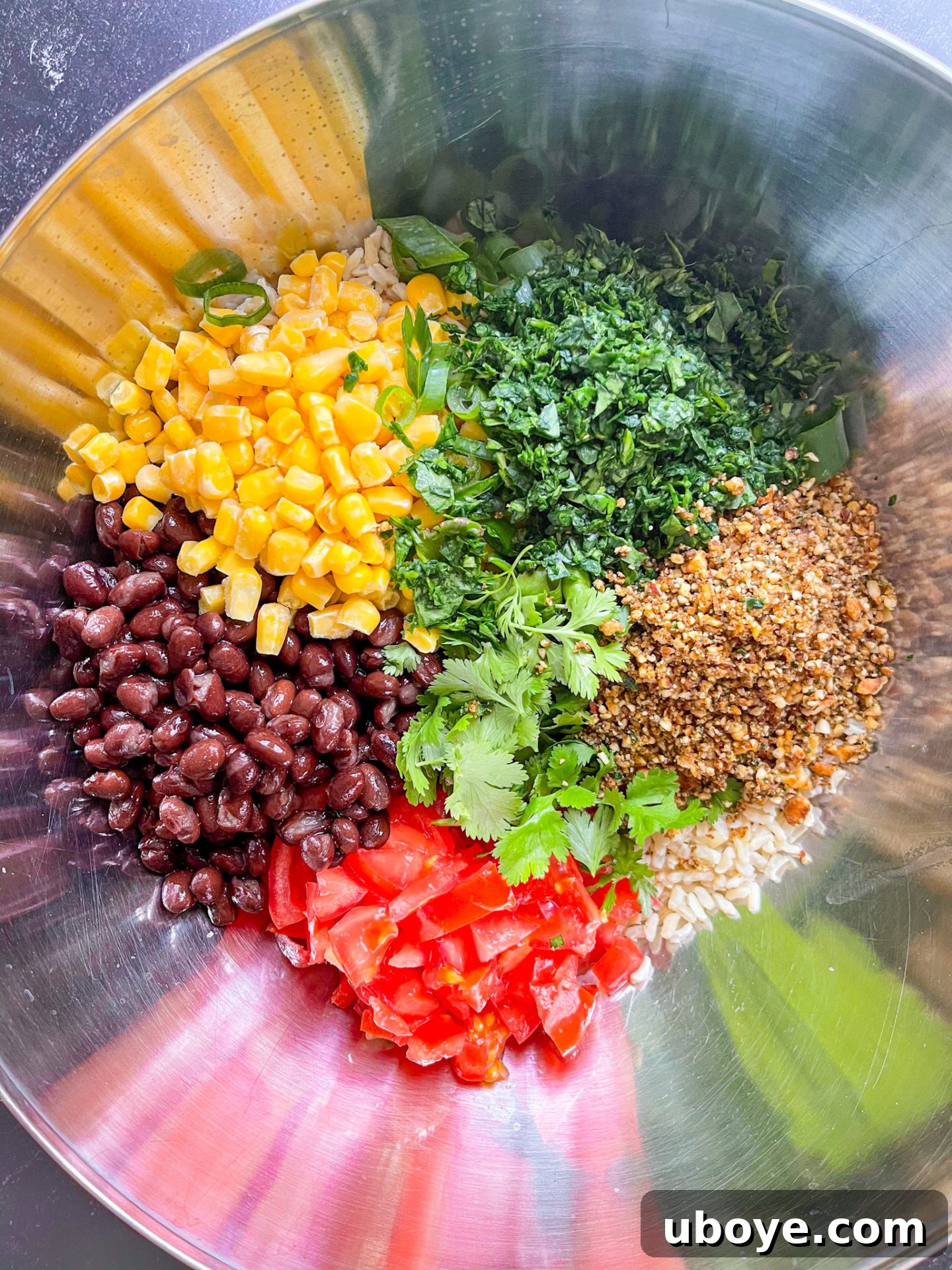 Assortment of fresh ingredients for black bean, corn, and salsa rice salad