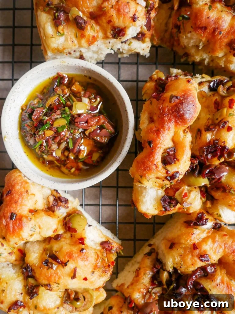 Close-up of fluffy Olive, Herb & Balsamic Focaccia with a crispy crust