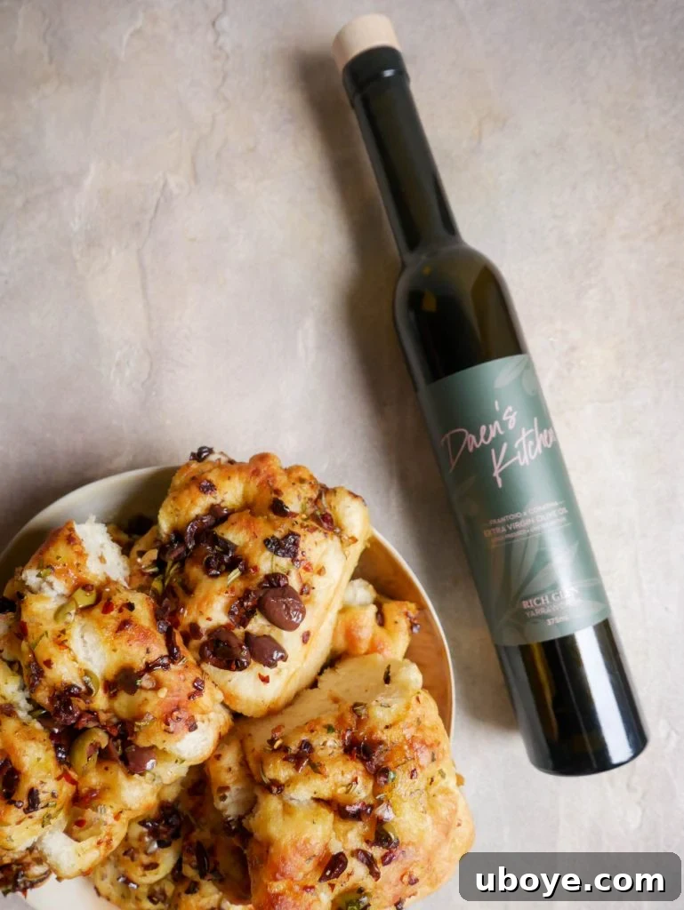 Olive, Herb and Balsamic Focaccia with a generous drizzle of sauce