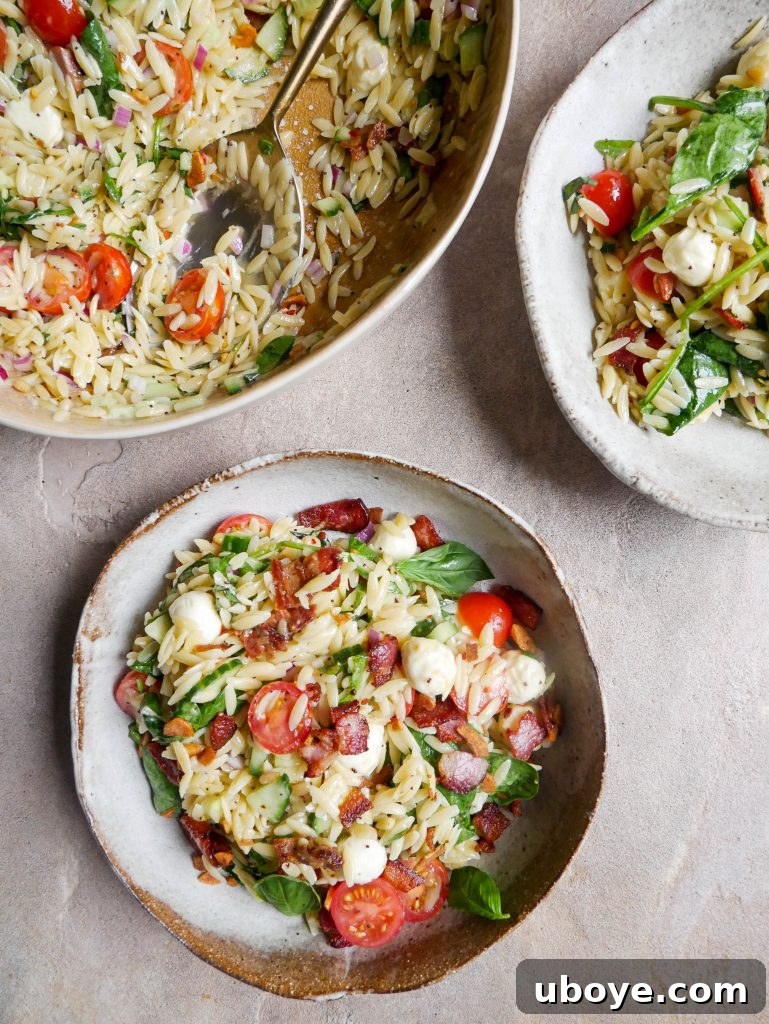 Basil garlic pesto pasta summer salad in a serving bowl