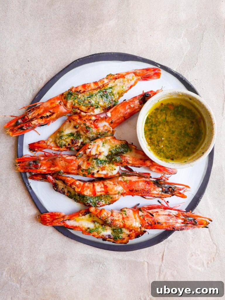 Close-up of Garlic Confit BBQ Butterflied Prawns glistening with butter