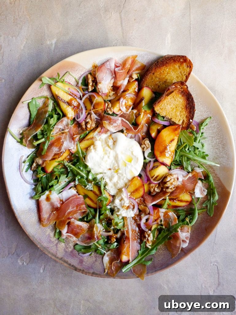 Blushing Peach Salad, Garlic Confit Infused 5 Fresh, vibrant green leaves and rocket, essential for a refreshing salad base.