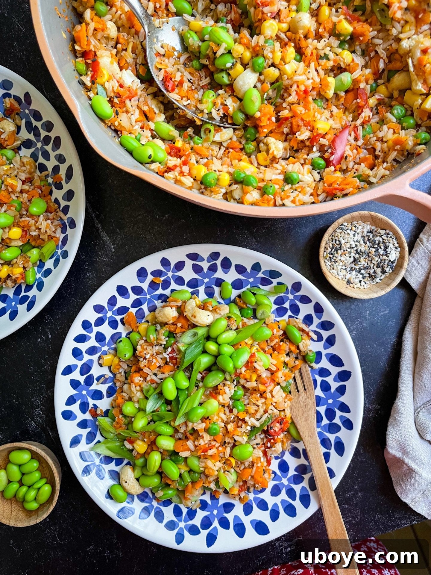 Delicious and healthy vegan fried rice with edamame, showcasing vibrant vegetables and a savory sauce.