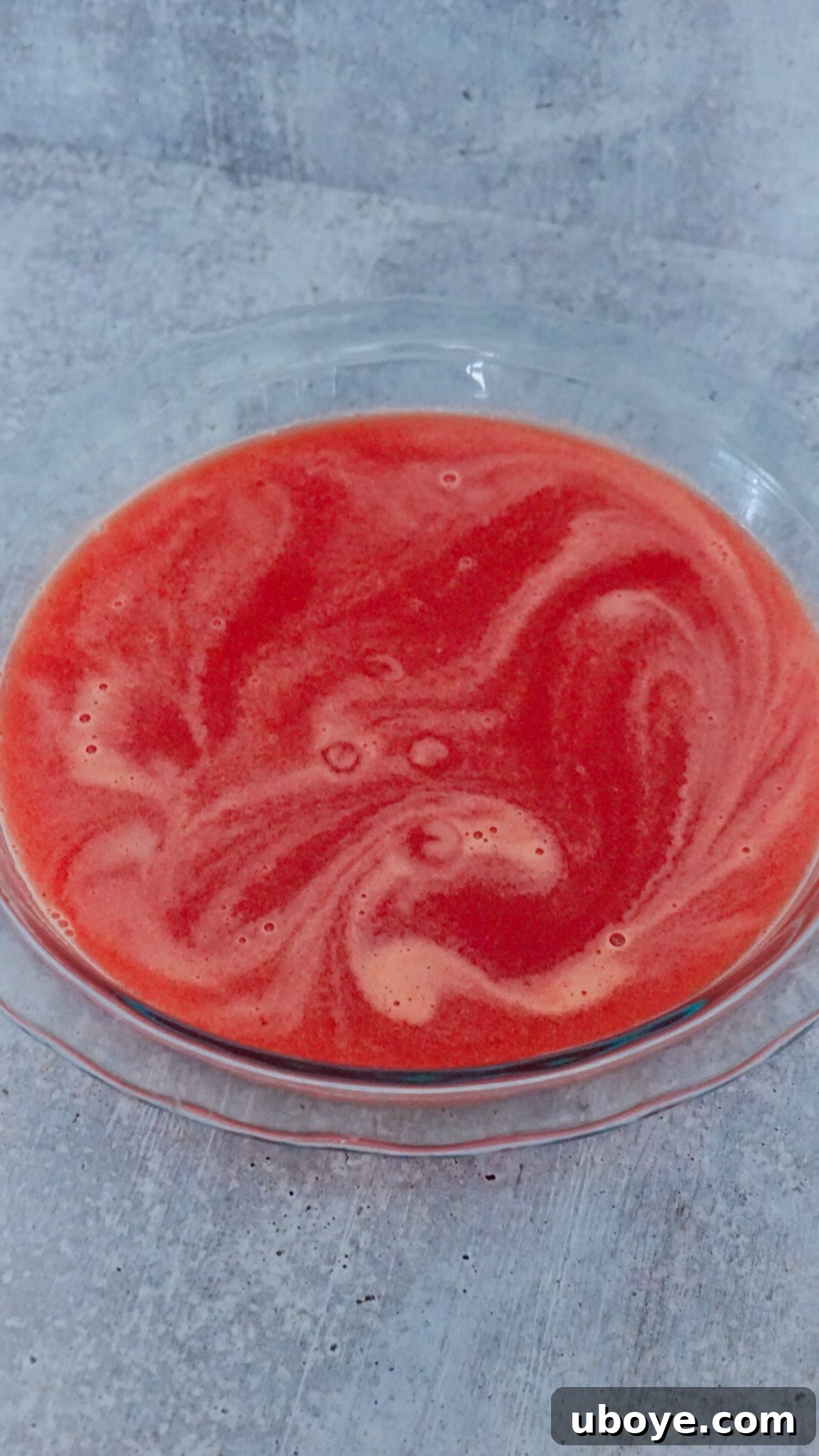 Adding sweetener and rosé to watermelon granita base