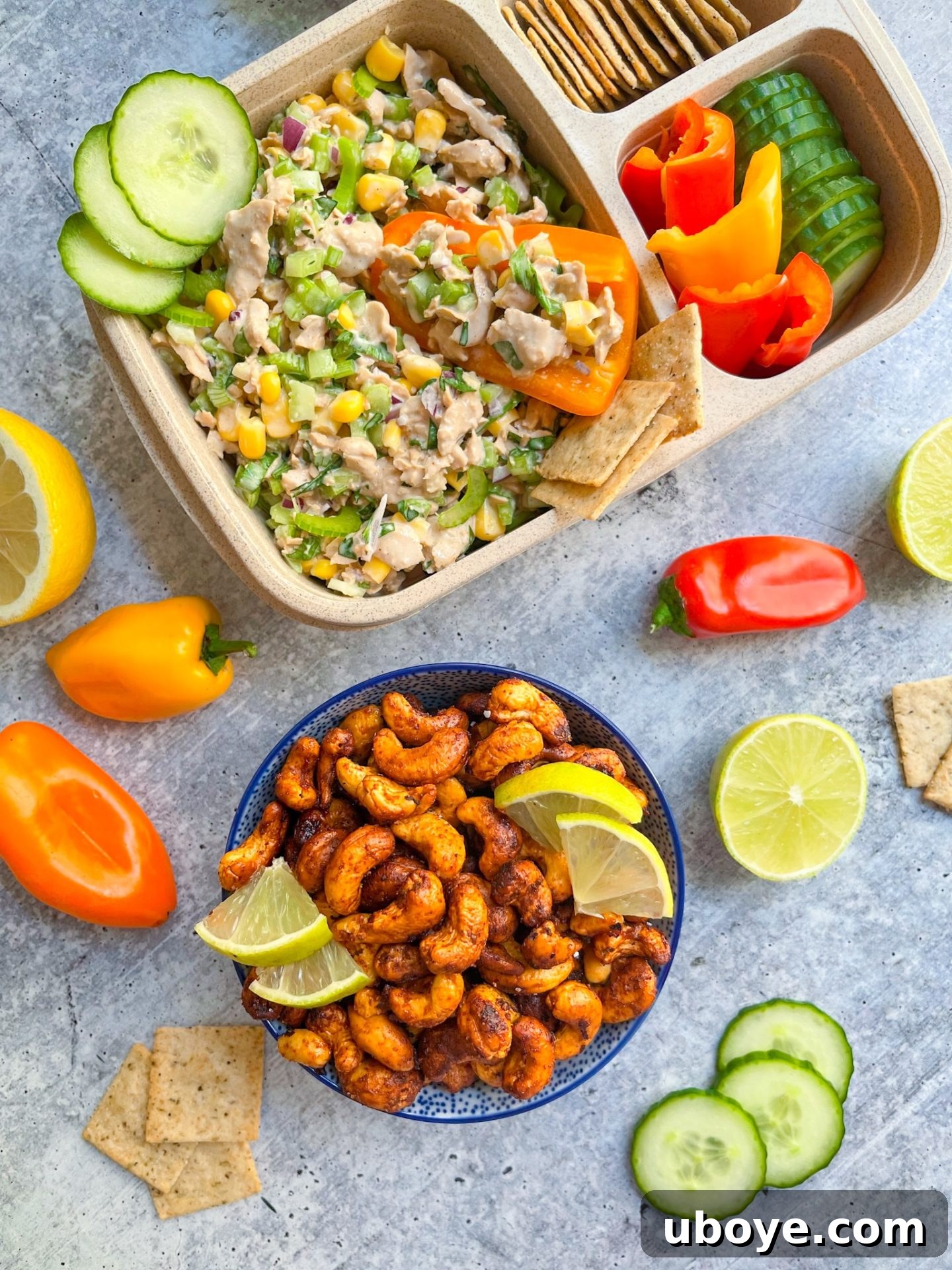 Chili lime cashews in a lunchbox with a vegan seafood salad, showcasing a perfect meal prep snack.