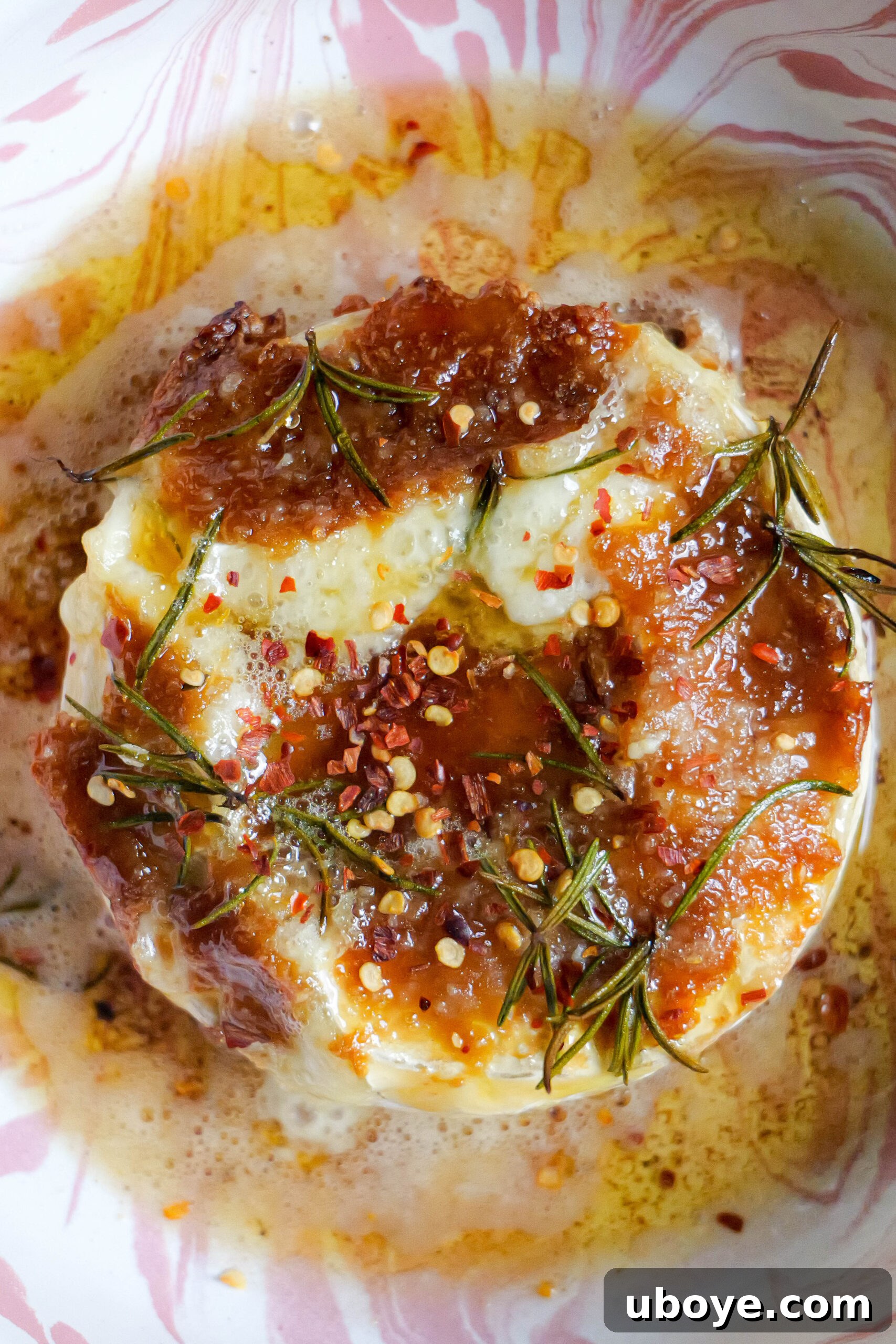 Holiday Roasted Garlic Butter Baked Brie 4 Baked brie with roasted garlic butter sits in pink and white tray
