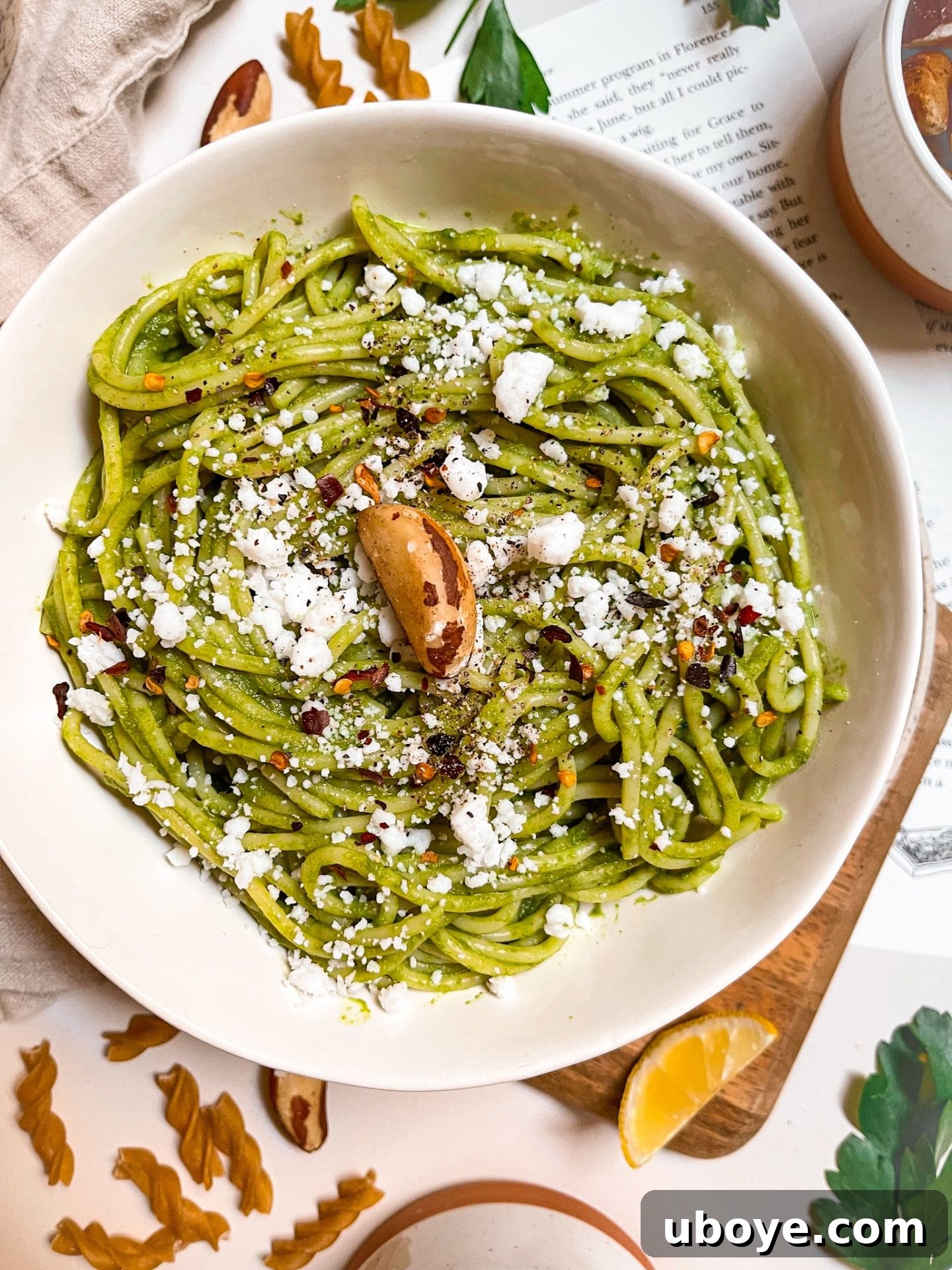 A vibrant green bowl of freshly made vegan Brazil nut pesto, ready to be served.