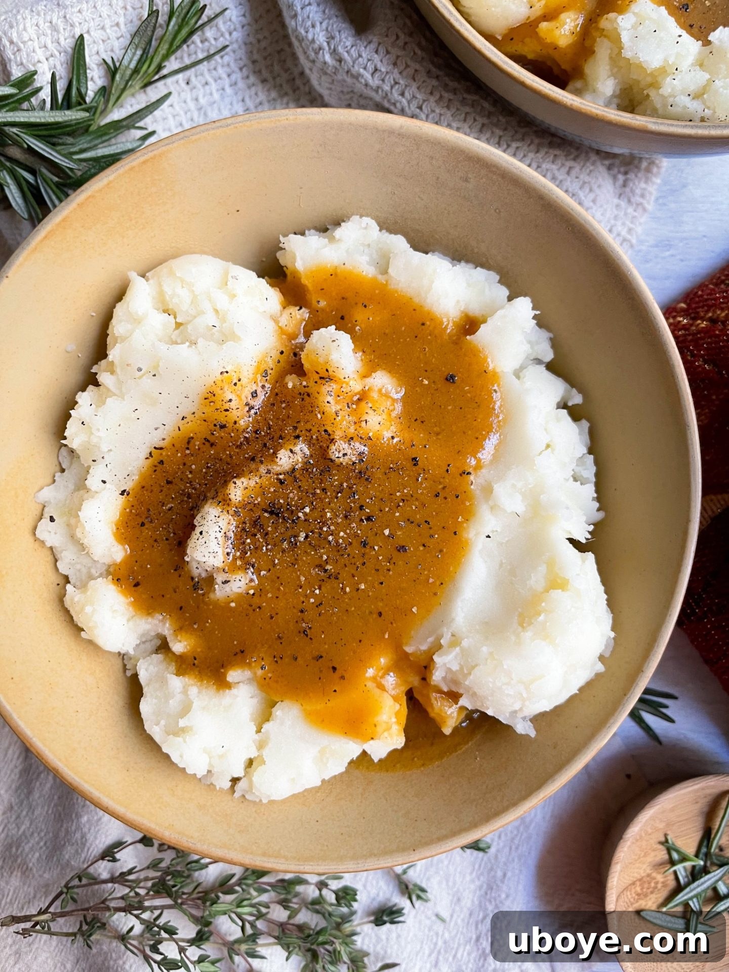 Rich and smooth dairy-free vegan gravy with creamy mashed potatoes, perfect for a quick Thanksgiving side