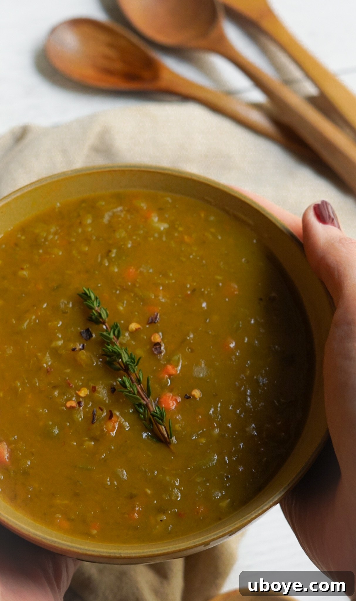 Creamy dairy-free and gluten-free split green pea soup recipe, garnished and ready to serve.