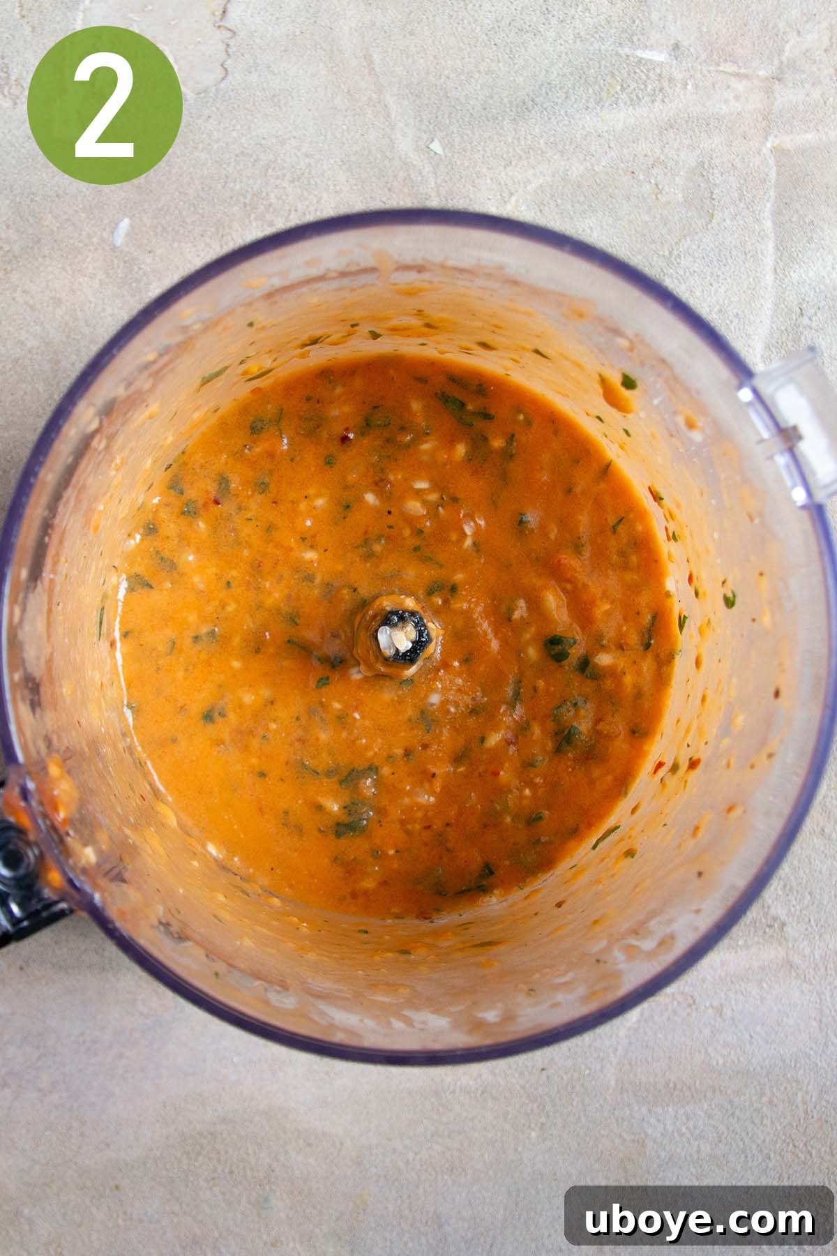 Mediterranean Tomato Treasures 5 Blended tomato mixture in a food processor, showing a coarse yet combined consistency, ready for the rice.