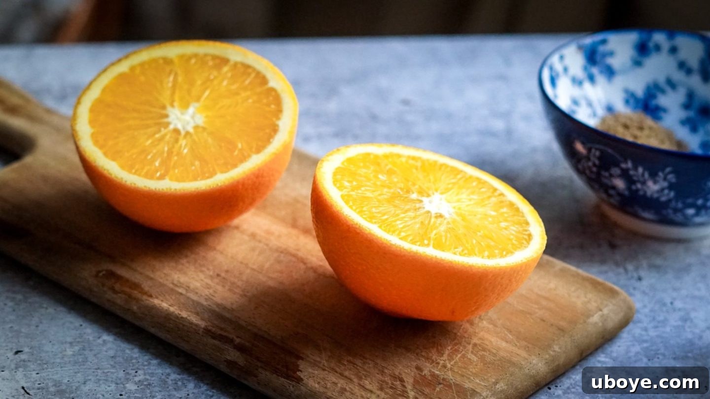 Decadent Vegan Gingerbread Cake 3 Fresh oranges on a cutting board, ready for juicing