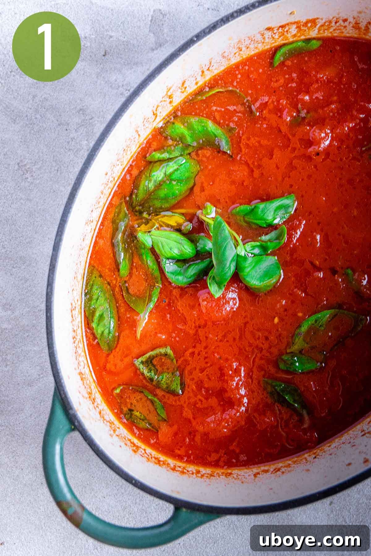 Hearty Beef and Rice Stuffed Peppers 4 Tomato and basil sauce simmering in an oval pot.