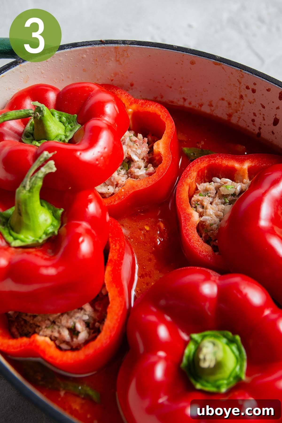 Hearty Beef and Rice Stuffed Peppers 6 Stuffing bell peppers with the beef and rice mixture and placing them in the tomato sauce.