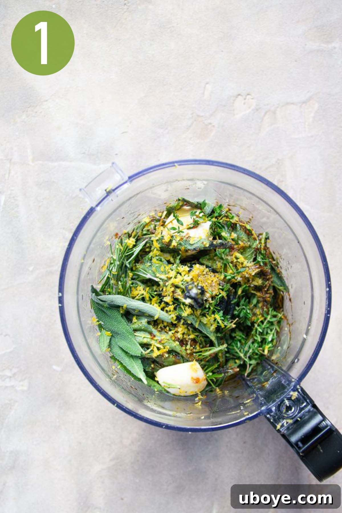 Fresh herbs, garlic, and other marinade ingredients being processed in a food processor.