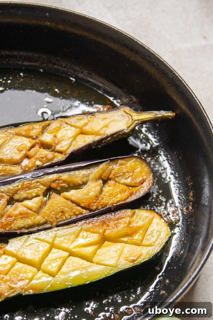 Fire-Kissed Vegetable Bruschetta 4 A single, perfectly grilled eggplant slice, showcasing its tender flesh