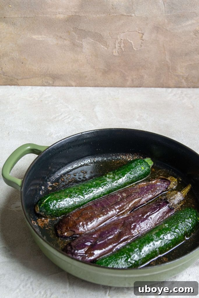 Fire-Kissed Vegetable Bruschetta 5 Fresh zucchini being sliced on a cutting board, ready for preparation