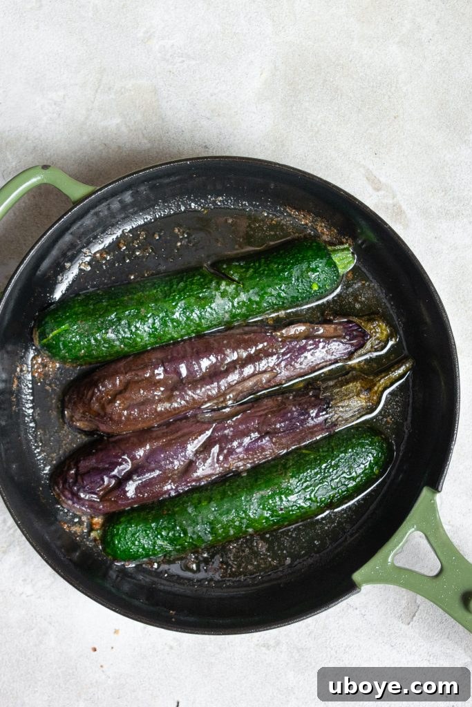 Fire-Kissed Vegetable Bruschetta 7 A cast iron pan with grilled eggplant and zucchini slices, fresh from the oven