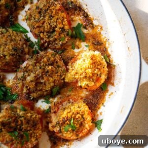 breadcrumb stuffed tomatoes in a cast iron pot.