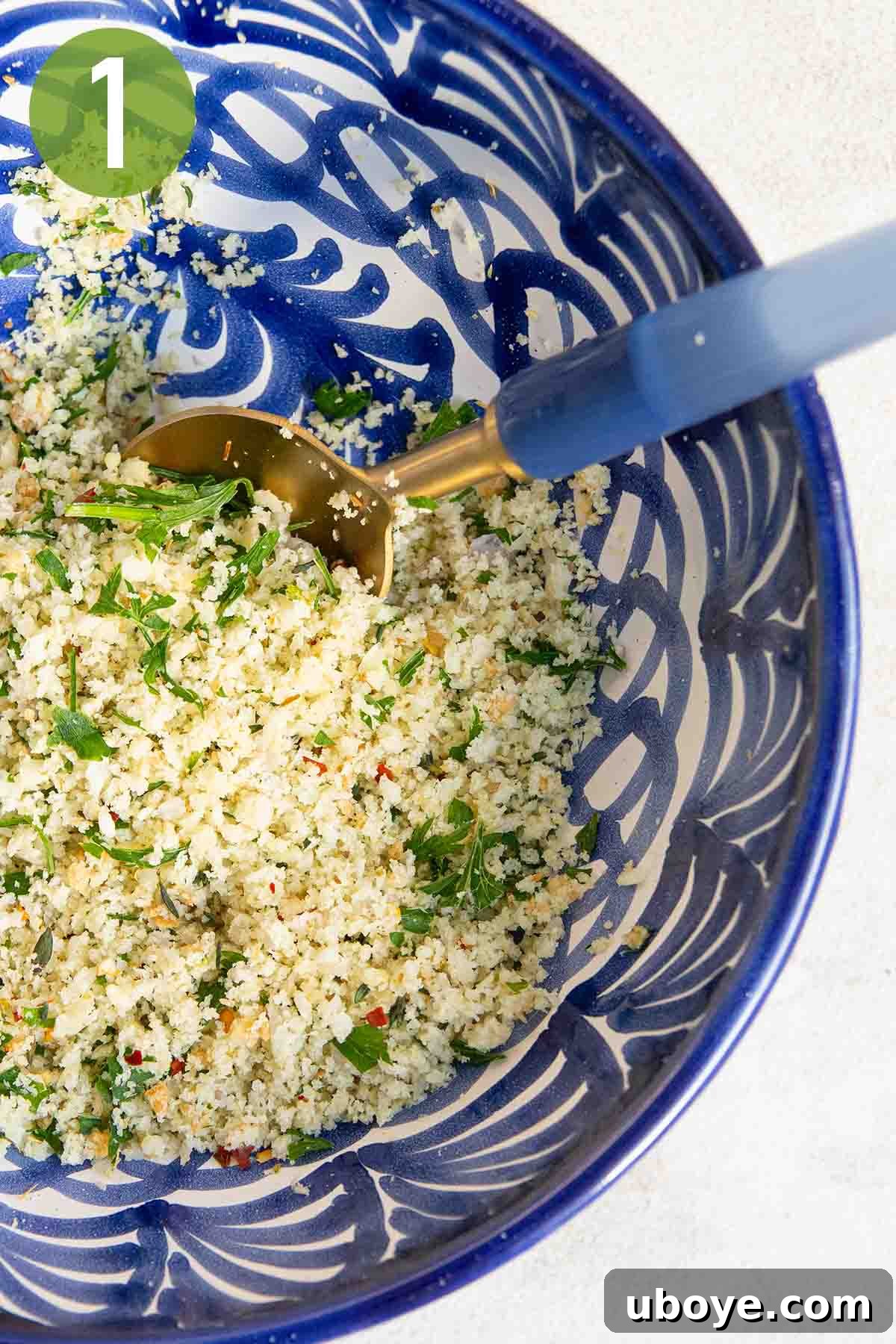 Sun-Kissed Roasted Tomatoes with Garlic-Herb Crumble 4 combining the herbs and breadcrumbs in a blue bowl.