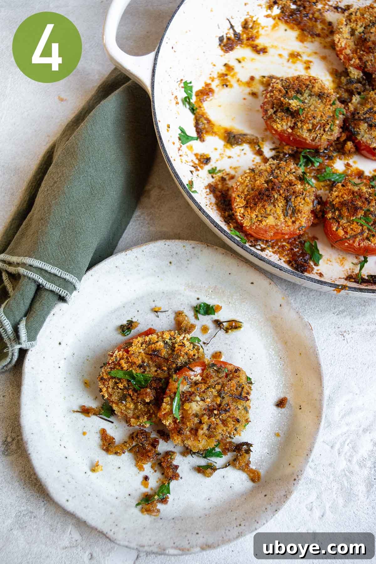 Sun-Kissed Roasted Tomatoes with Garlic-Herb Crumble 7 two breadcrumb stuffed tomatoes on a white plate.