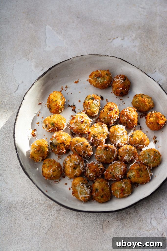 Crispy Goats Cheese Stuffed Olives with rich garlic confit