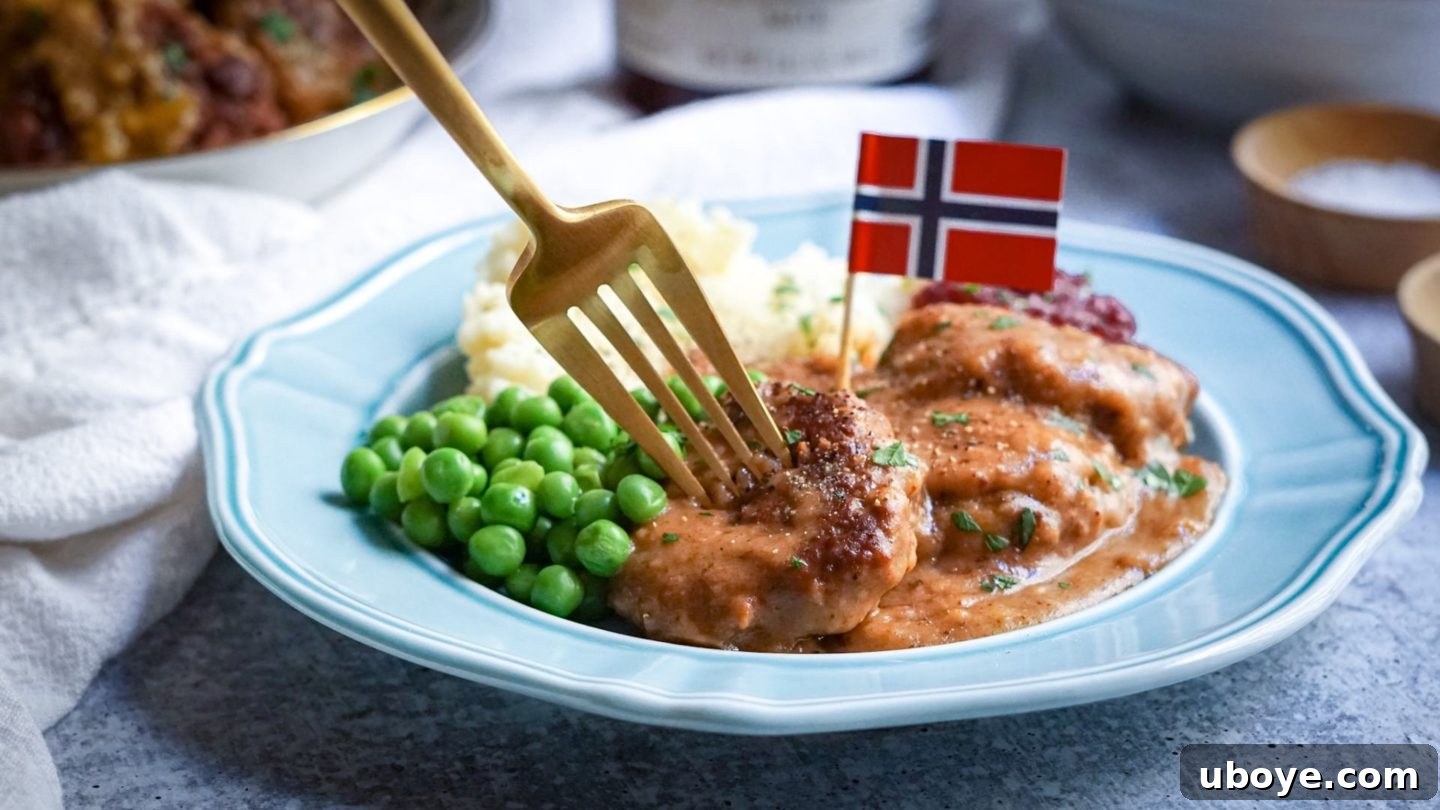 Vegan Meatballs in Gravy Vegan Norwegian meatballs fully submerged in rich brown gravy, simmering.