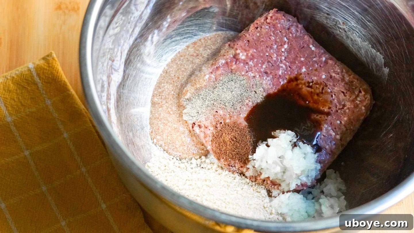 Beyond Beef Meatballs Recipe Step 1 Mixing vegan ground beef with spices and binders for meatballs.