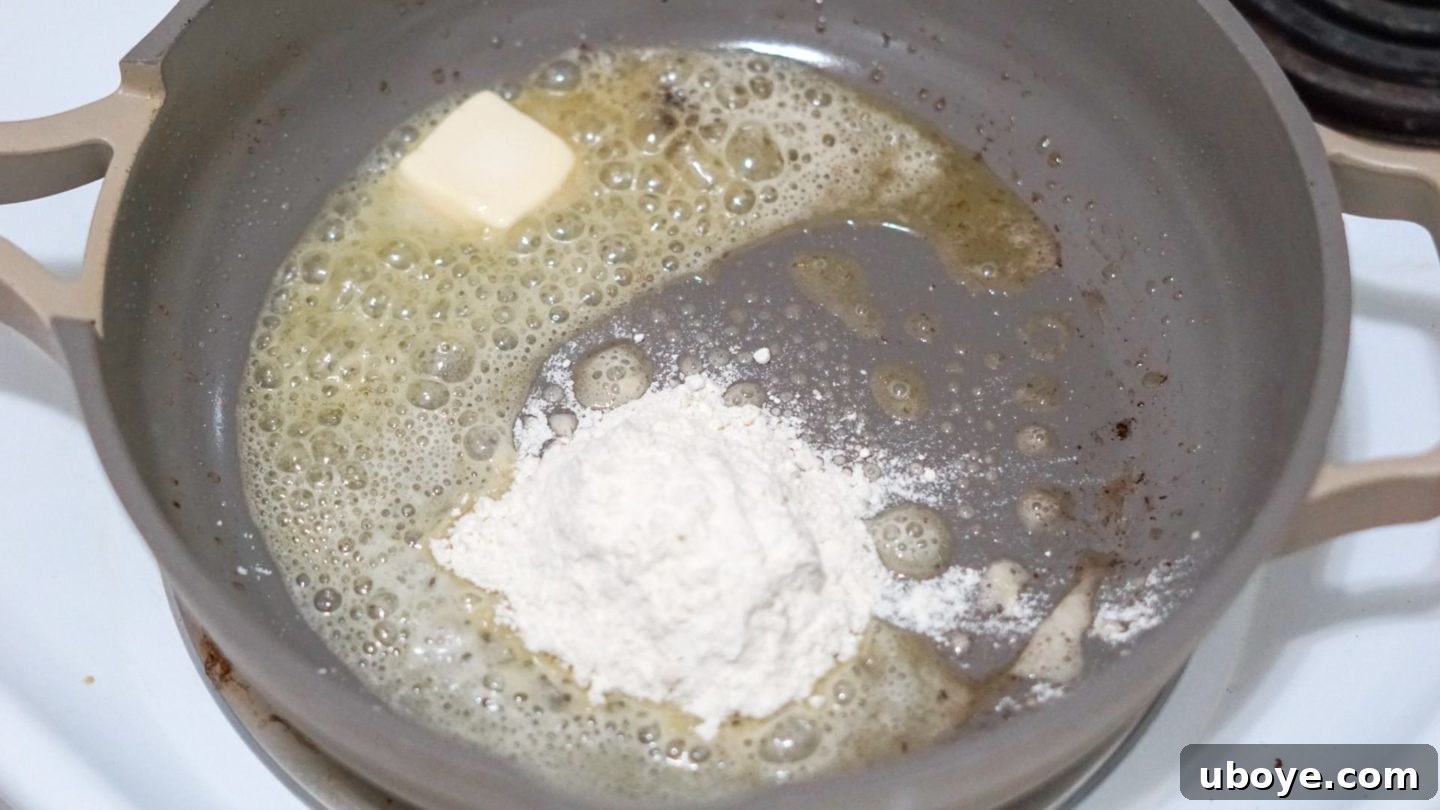 Vegan Butter Melting in Pan Melted vegan butter in a frying pan, ready for flour to make a roux.