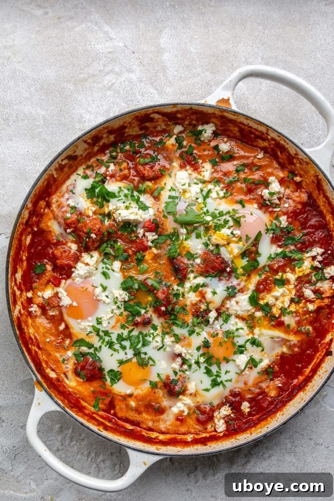 Shirred Eggs 5 Sliced chorizo sizzling in a pan, releasing flavorful oils
