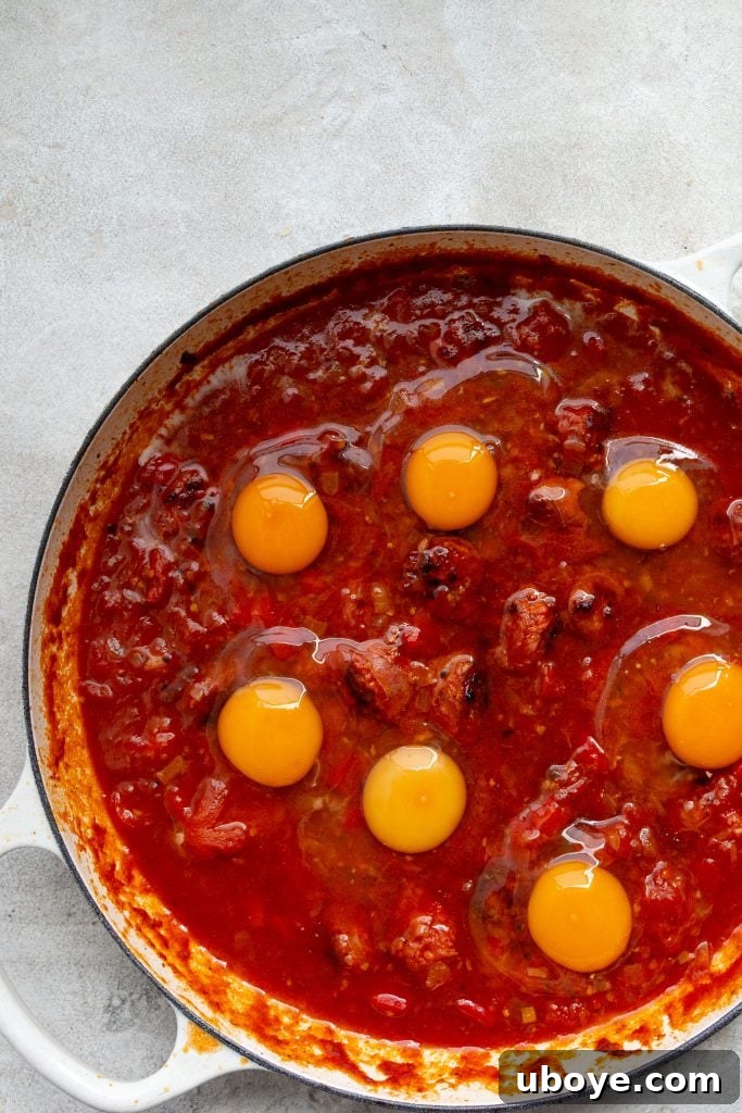 Shirred Eggs 7 Baked eggs simmering in a covered pan, cooking to perfection