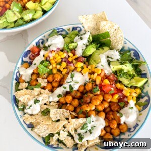 Delicious chickpea taco salad on a blue and white plate, garnished and ready to serve.
