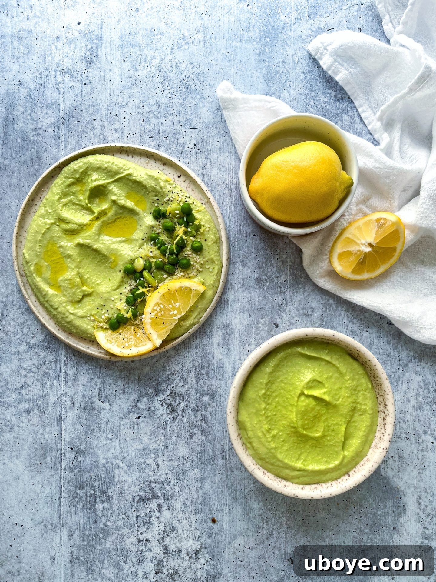 Bright Lemon Lima Hummus 4 Two serving options of homemade lima bean hummus: one in a small bowl, the other spread on a piece of toast, highlighting its versatility and appealing texture.