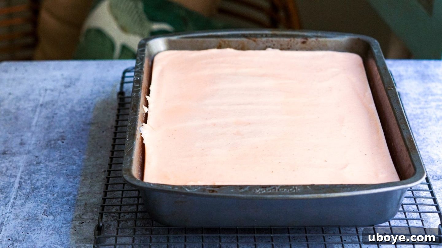 Crimson Lentil Blocks 5 Thickened red lentil tofu batter being stirred in a saucepan with a whisk, showing its creamy texture.